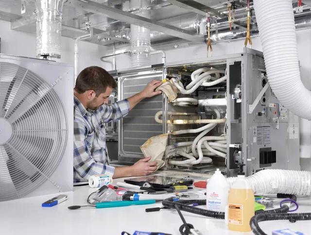 Groton Air Duct Cleaning specialist performing precision AC coil cleaning in Groton