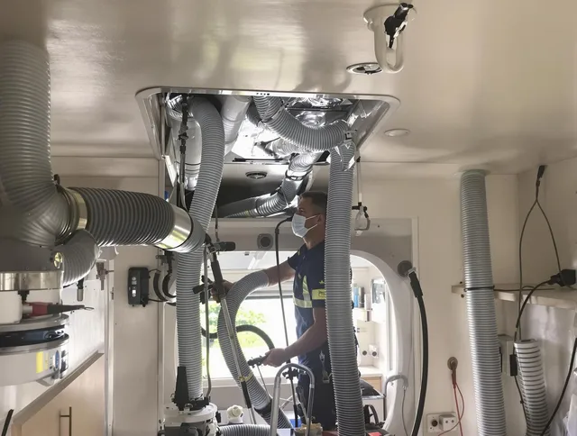 Groton Air Duct Cleaning specialist performing precise mobile home duct cleaning in Groton