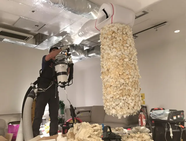 Groton Air Duct Cleaning technician performing precision vacuum insulation removal in a residential property in Groton