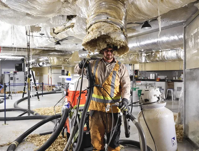 Professional vacuum insulation removal by Groton Air Duct Cleaning expert in Groton